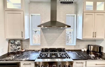 Beautiful Kitchen Remodel in Crown Valley by Stanton and Company featuring Stainless Appliances, backsplash and new countertops