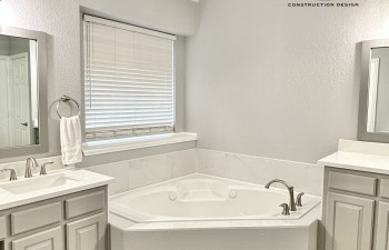 Renovated Master Bath double vanities and whirlpool tub by Stanton and Company in Aledo, TX